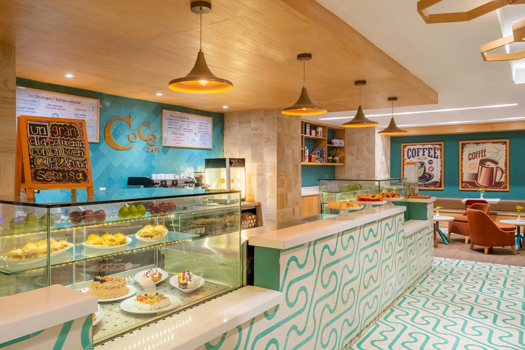 Coco Café at Dreams Acapulco Resort & Spa featuring a modern coffee bar with pastry displays, premium espresso drinks, and cozy lounge seating.