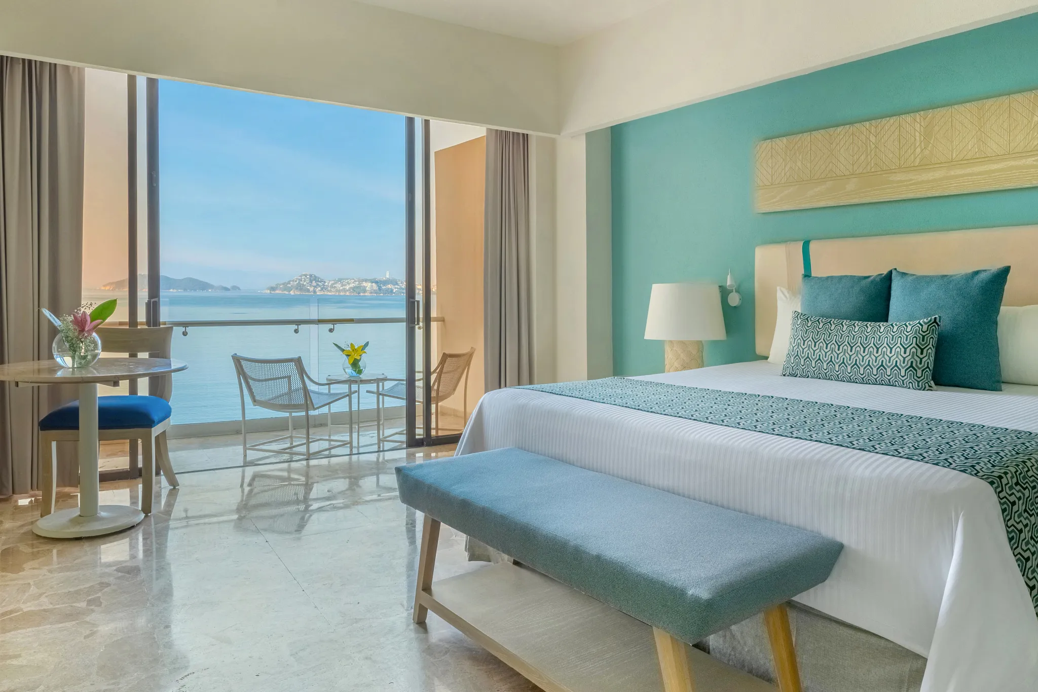 Deluxe Ocean View room with king bed and balcony at Dreams Acapulco Resort & Spa.
