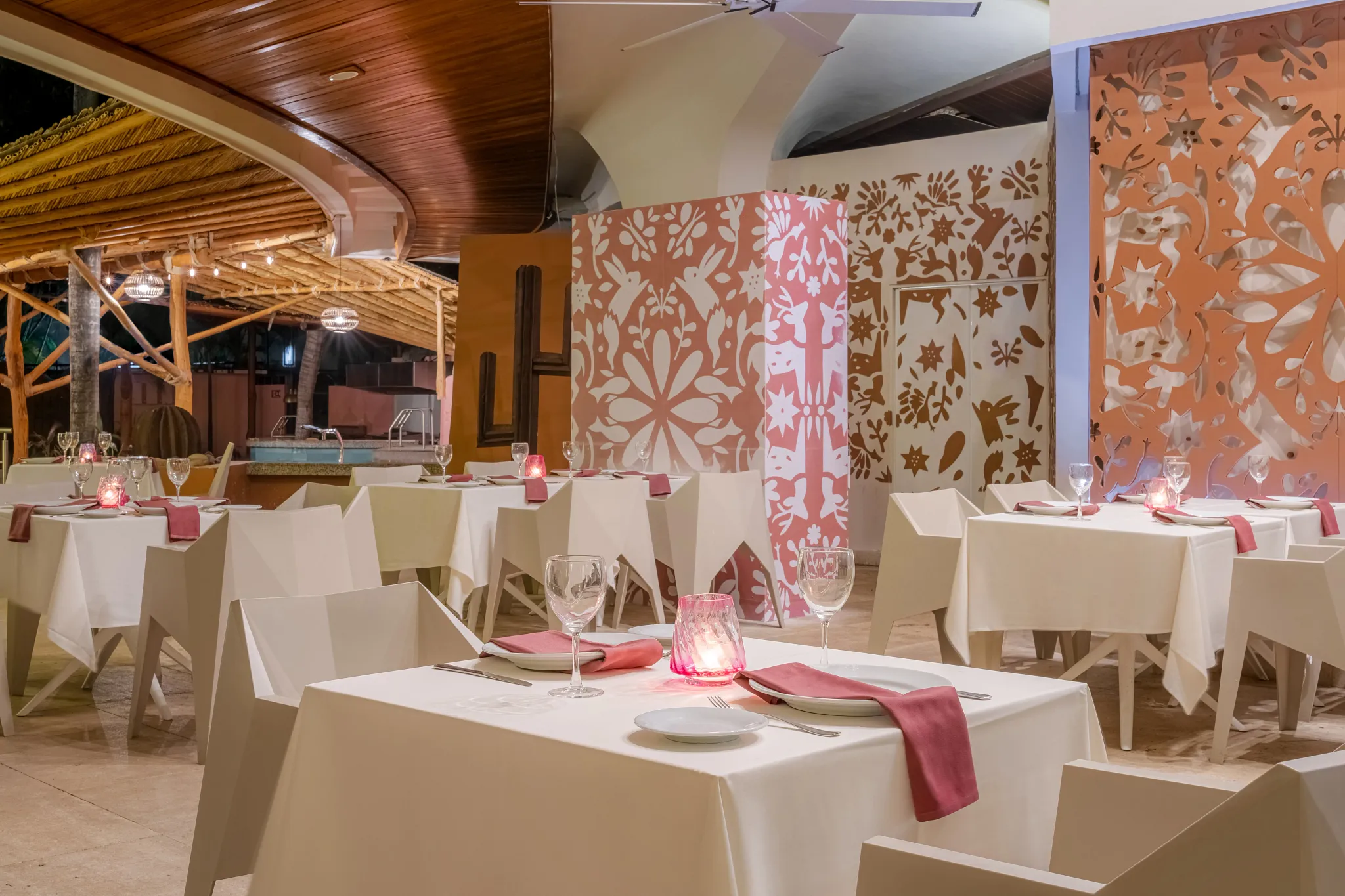 El Patio Mexican Restaurant at Dreams Acapulco Resort & Spa featuring elegant table settings, modern Mexican décor, and an intimate dining atmosphere.