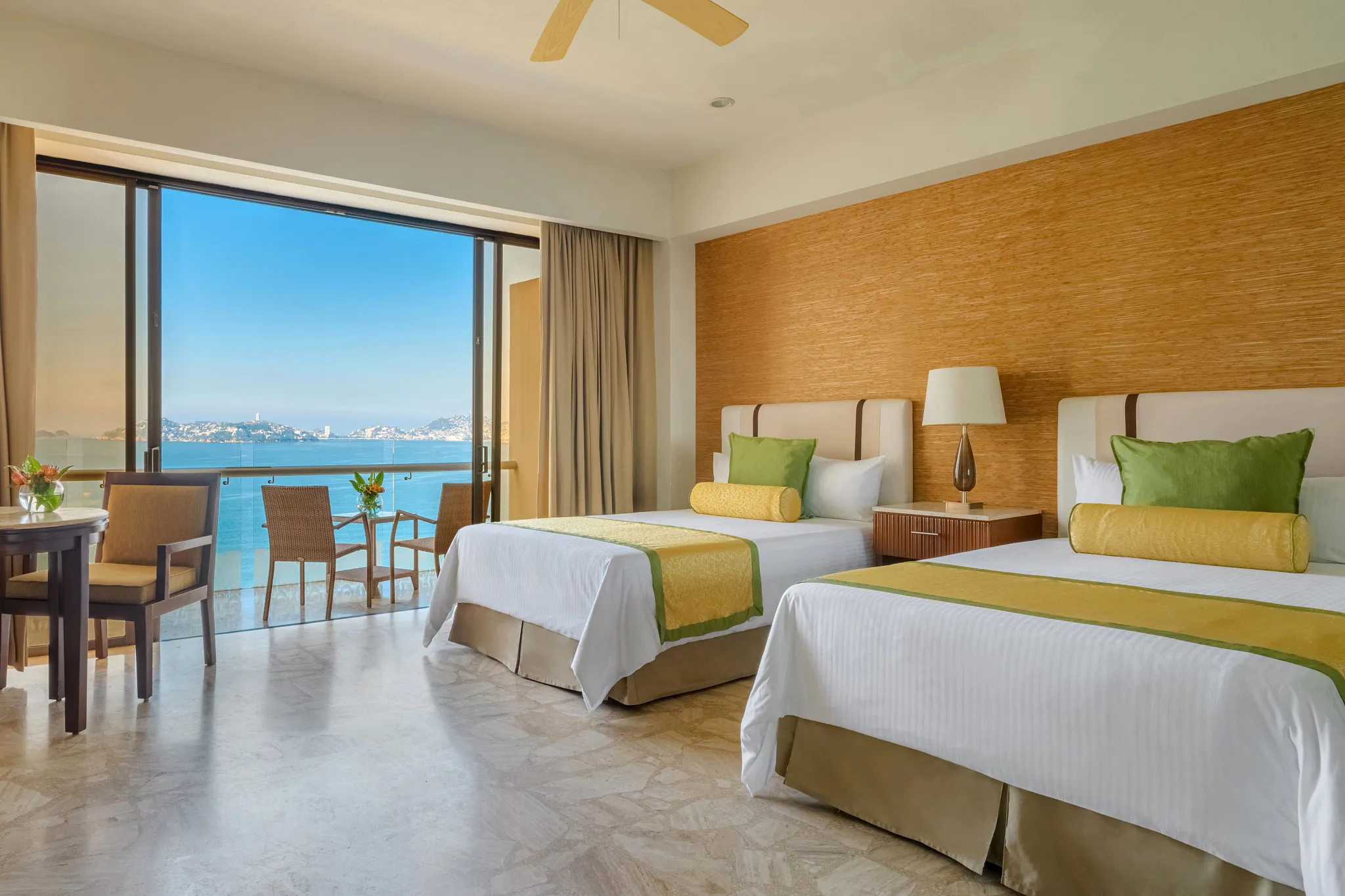 Preferred Club Deluxe Ocean View room with two double beds and private balcony at Dreams Acapulco Resort & Spa.
