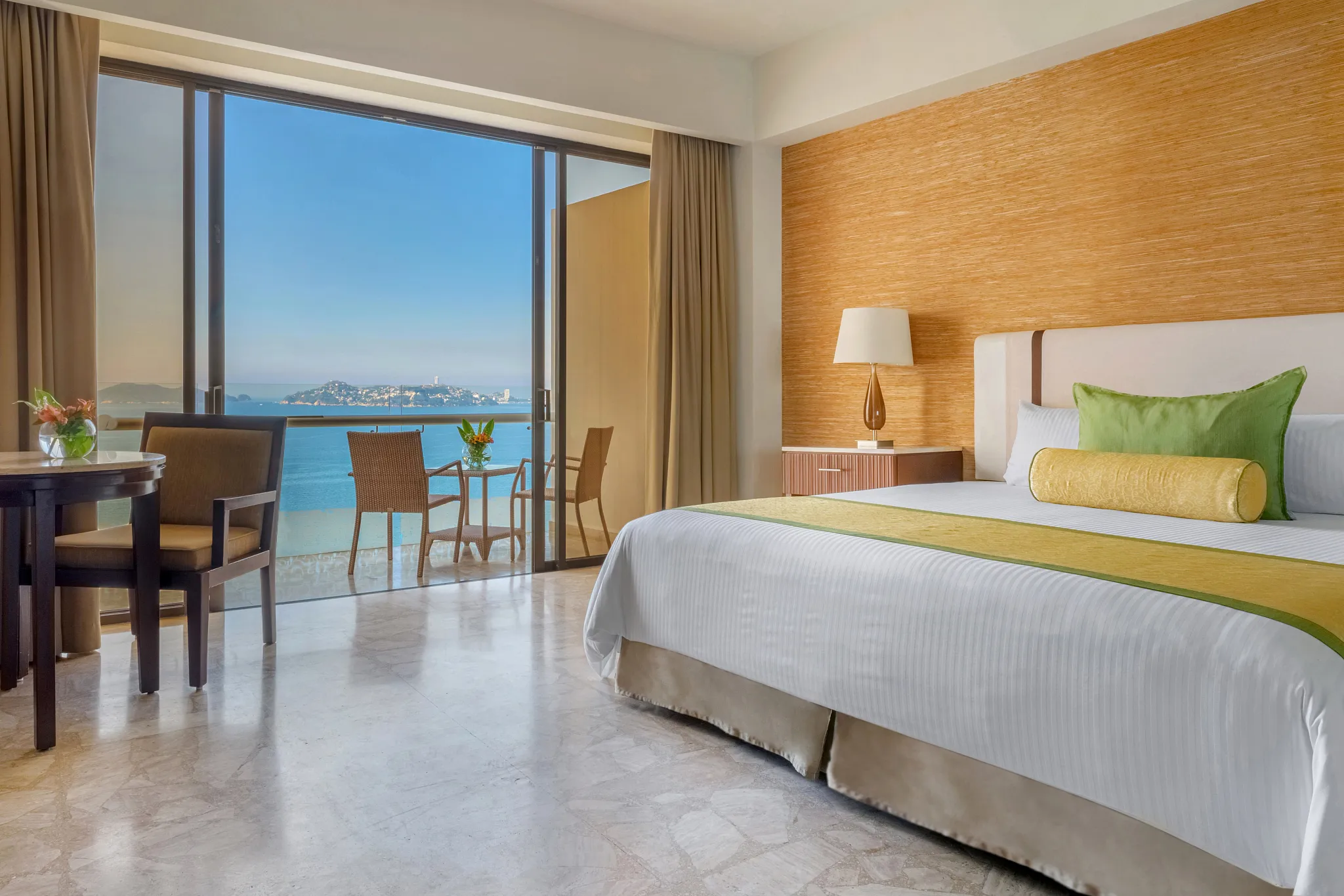 Preferred Club Deluxe Ocean View room with king bed and balcony at Dreams Acapulco Resort & Spa.
