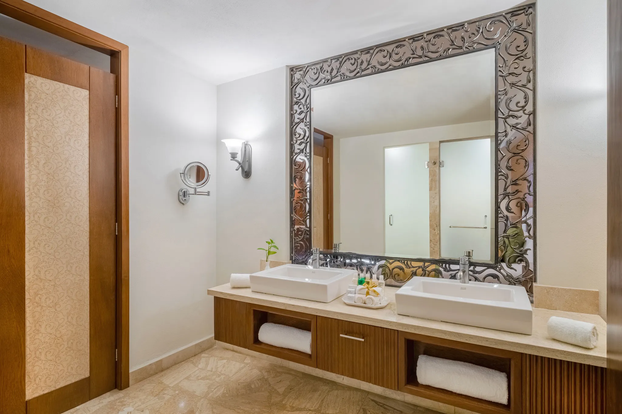 Preferred Club Deluxe Partial Ocean View bathroom with dual sinks and separate shower at Dreams Acapulco Resort & Spa.
