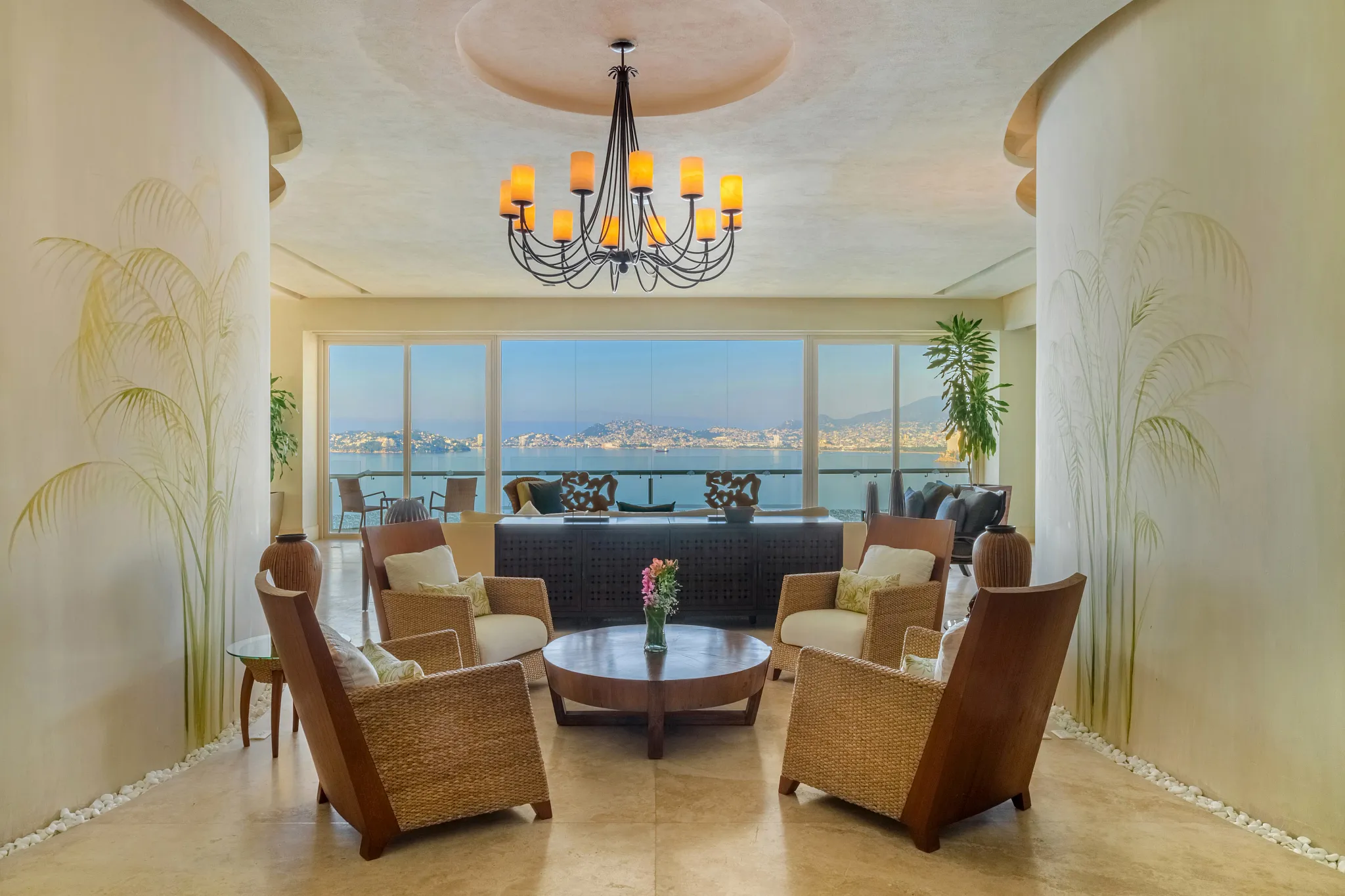 Preferred Club Presidential Three-Bedroom Ocean Front suite entry sitting area at Dreams Acapulco Resort & Spa with panoramic bay views.