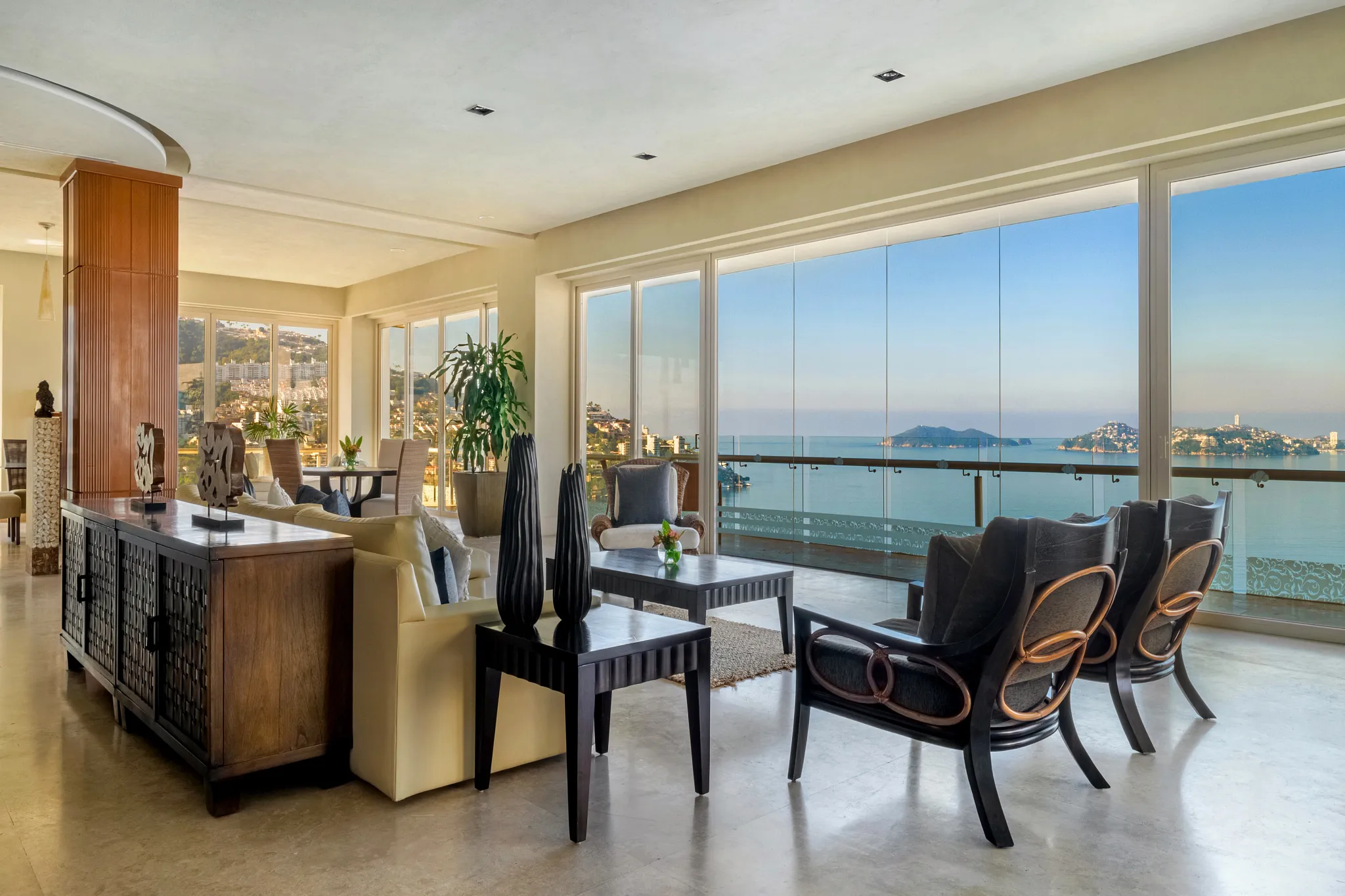 Preferred Club Presidential Three-Bedroom Ocean Front living room with floor-to-ceiling windows at Dreams Acapulco Resort & Spa.
